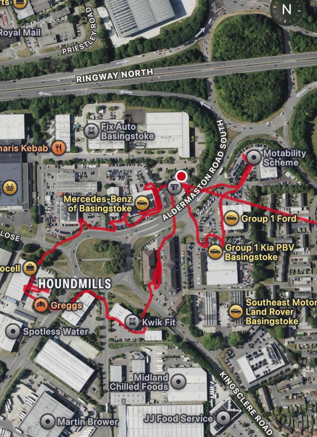 Aerial GPS-recorded route map showing a road closure notice round through an industrial and retail park, past car dealerships and takeaway outlets